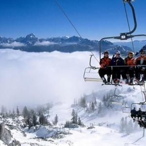 Ski lift with people in the gondola