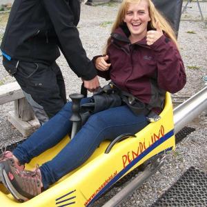 A woman sits in a yellow rubber dinghy